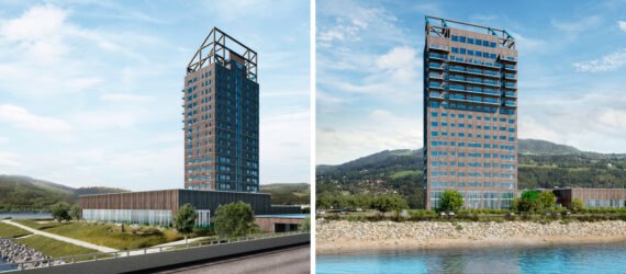 tall wood building overlooking hills and lake