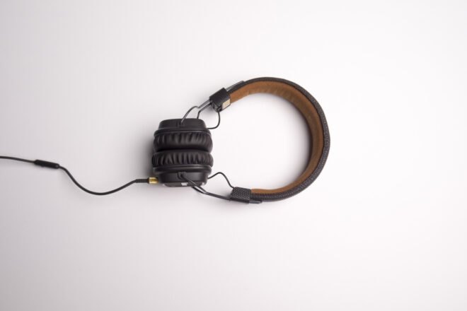 black and brown headphones on white background