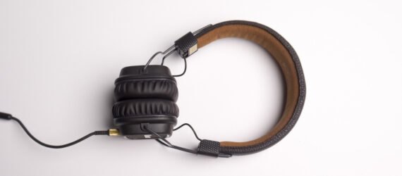 black and brown headphones on white background