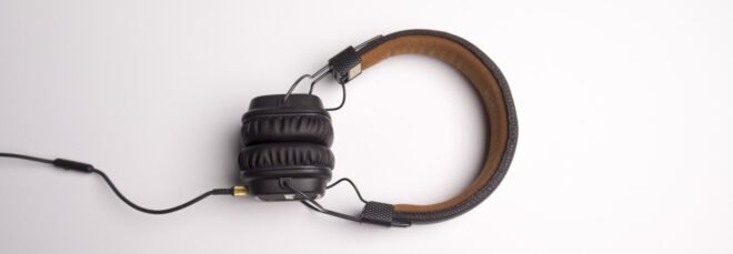 black and brown headphones on white background