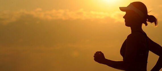 woman's silhouette running at sunset
