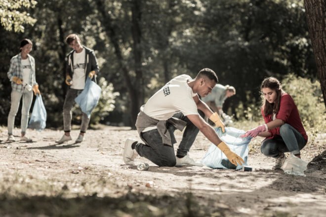 volunteers helping clean up trash