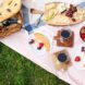 flat-lay of picnic foods on picnic blanket