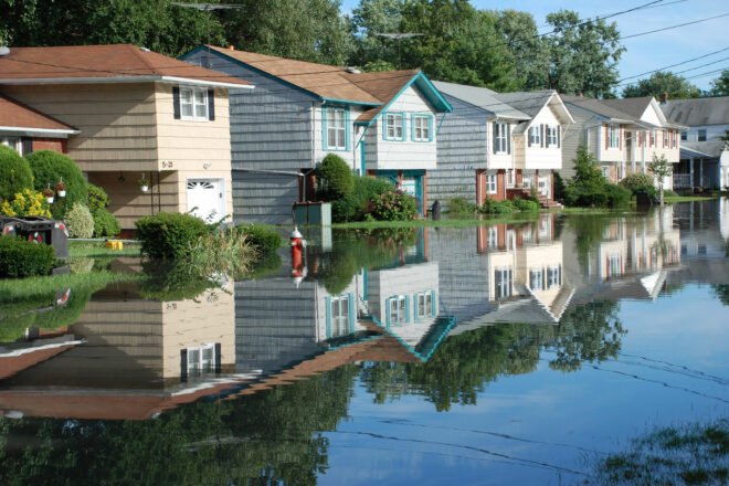 colorful houses partially submerged in flood waters