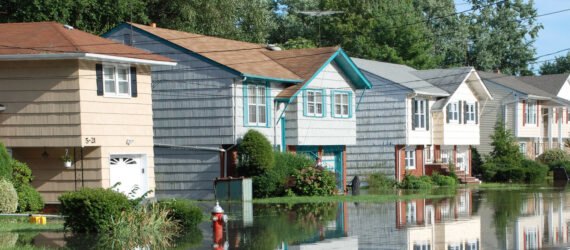 colorful houses partially submerged in flood waters