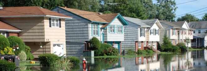 colorful houses partially submerged in flood waters