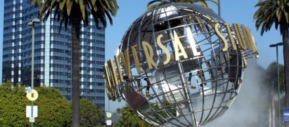 globe sculpture with UNIVERSAL sign in front