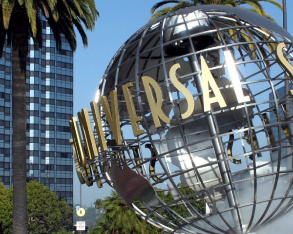 globe sculpture with UNIVERSAL sign in front