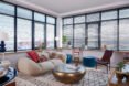 apartment living room with white couch and gold coffee table