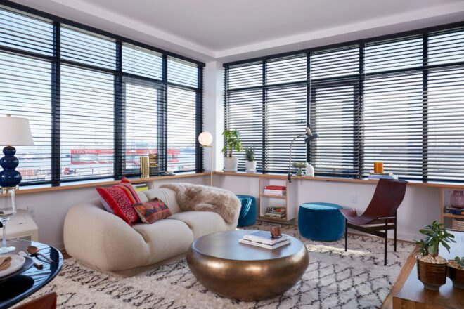 apartment living room with white couch and gold coffee table
