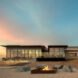 single-story building behind fire pit
