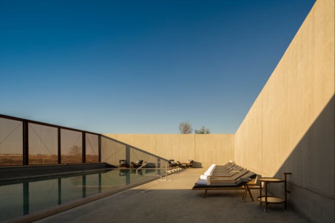 swimming pool surrounded by concrete wall