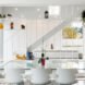 all white living area with glass dining table and white chairs