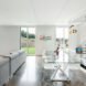 all white living space with glass dining table