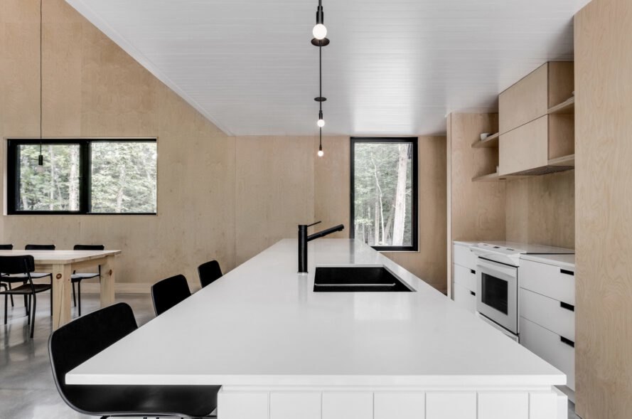 large kitchen with all-white countertops and cabinets