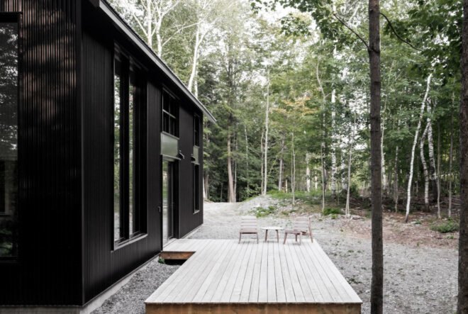 open-air deck leading out of black cabin