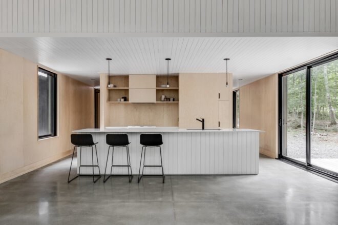 contemporary kitchen with bar stools in front of white kitchen island