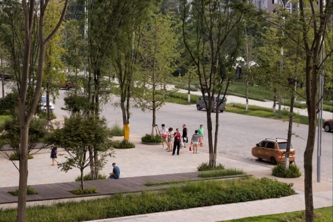 people walking around a large park