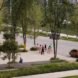 people walking around a large park