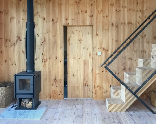 timber interior space with wood-burning stove