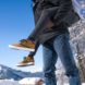 person wearing brown shoes in the snow