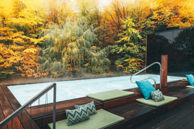 steaming pool surrounded by greenery