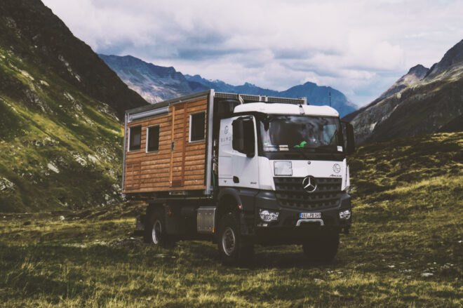 wooden motorhome parked in mountainous area