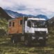 wooden motorhome parked in mountainous area