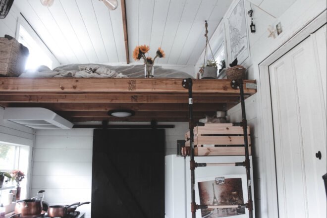 ladder leading up to sleeping loft in tiny home