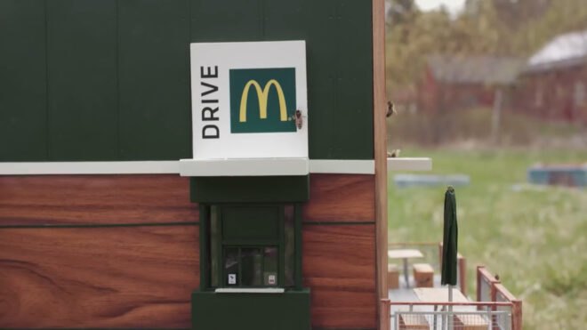 minature McDonald's restaurant with bees at drive-thru window