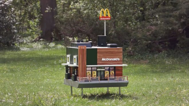 Miniature McDonald's restaurant in grass