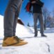 person wearing brown shoes in the snow
