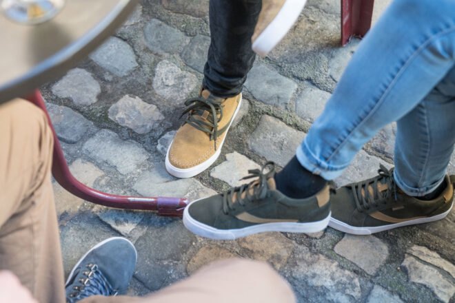 group of people wear light brown, green and blue shoes