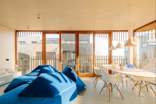 bright room with blue geometric couch