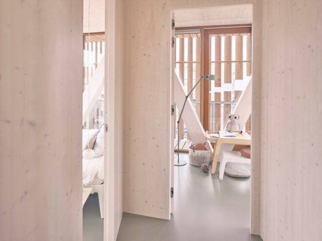 hallway opening up to multiple rooms