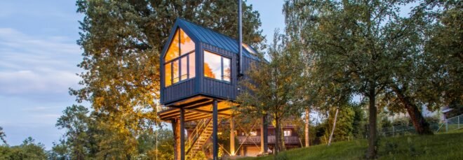 gabled treehouse surrounded by greenery