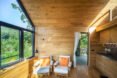 wood-lined room with two lounge chairs