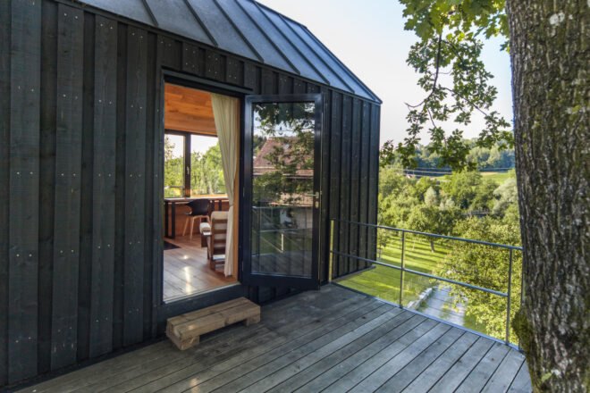 sliding glass door leading out to wooden deck