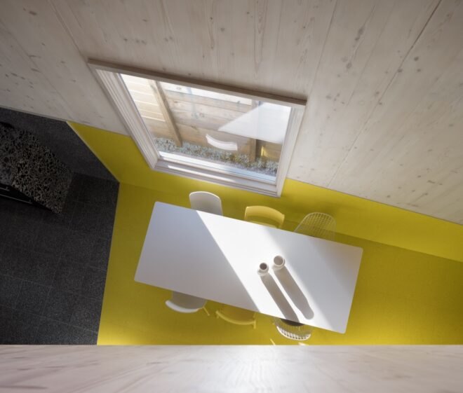 aerial view of dining table on yellow floor