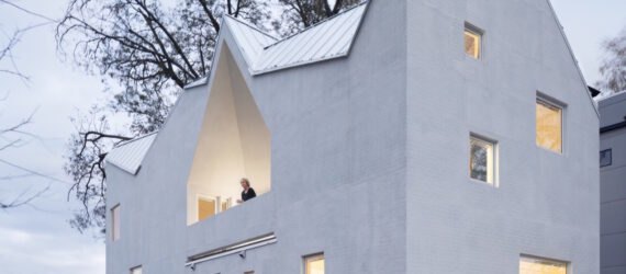 white house with multiple gabled roofs