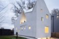 white house with multiple gabled roofs