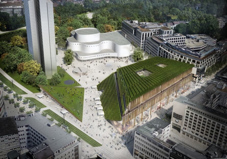 aerial view of trapezoid-shaped building with sloping green roof during the day