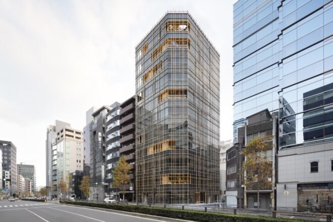black building with timber grid facade seen from the street