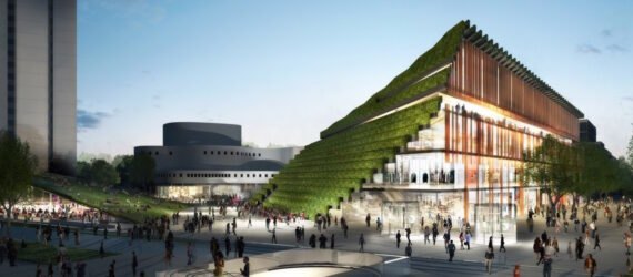 trapezoid-shaped building with sloping green roof