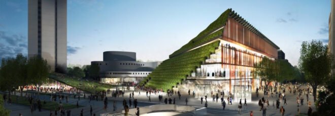 trapezoid-shaped building with sloping green roof