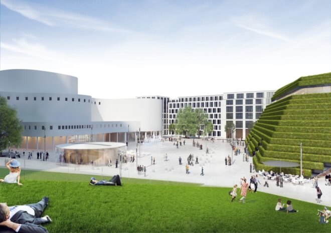 massive lawn next to trapezoid-shaped building with sloping green roof