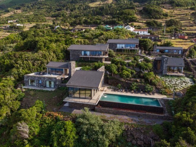 cluster of stone buildings with a pool