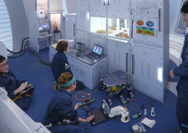 people assembling robotics