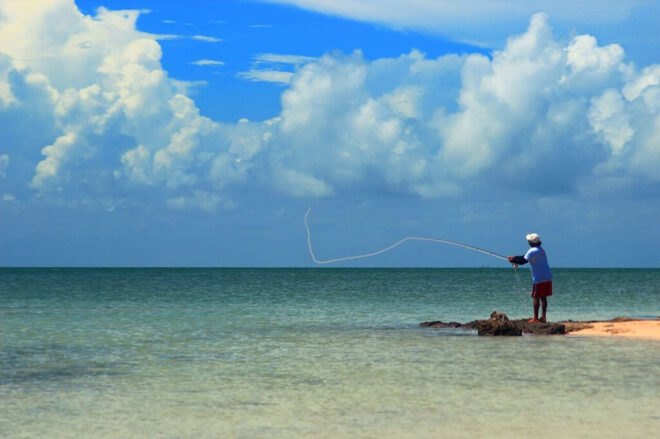 man fishing in ocean
