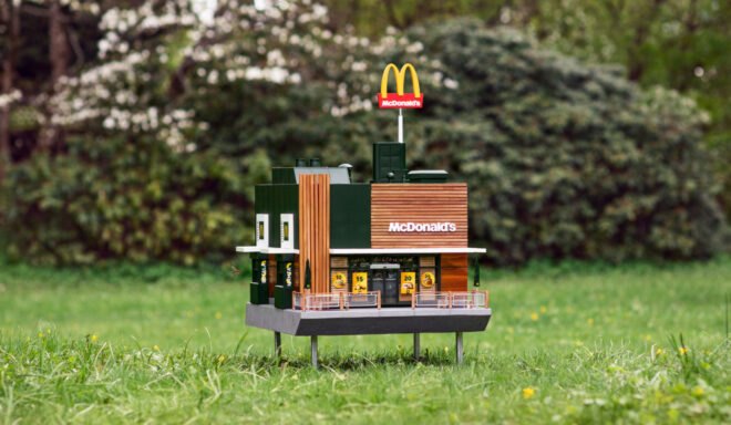 Miniature McDonald's restaurant in a grassy field